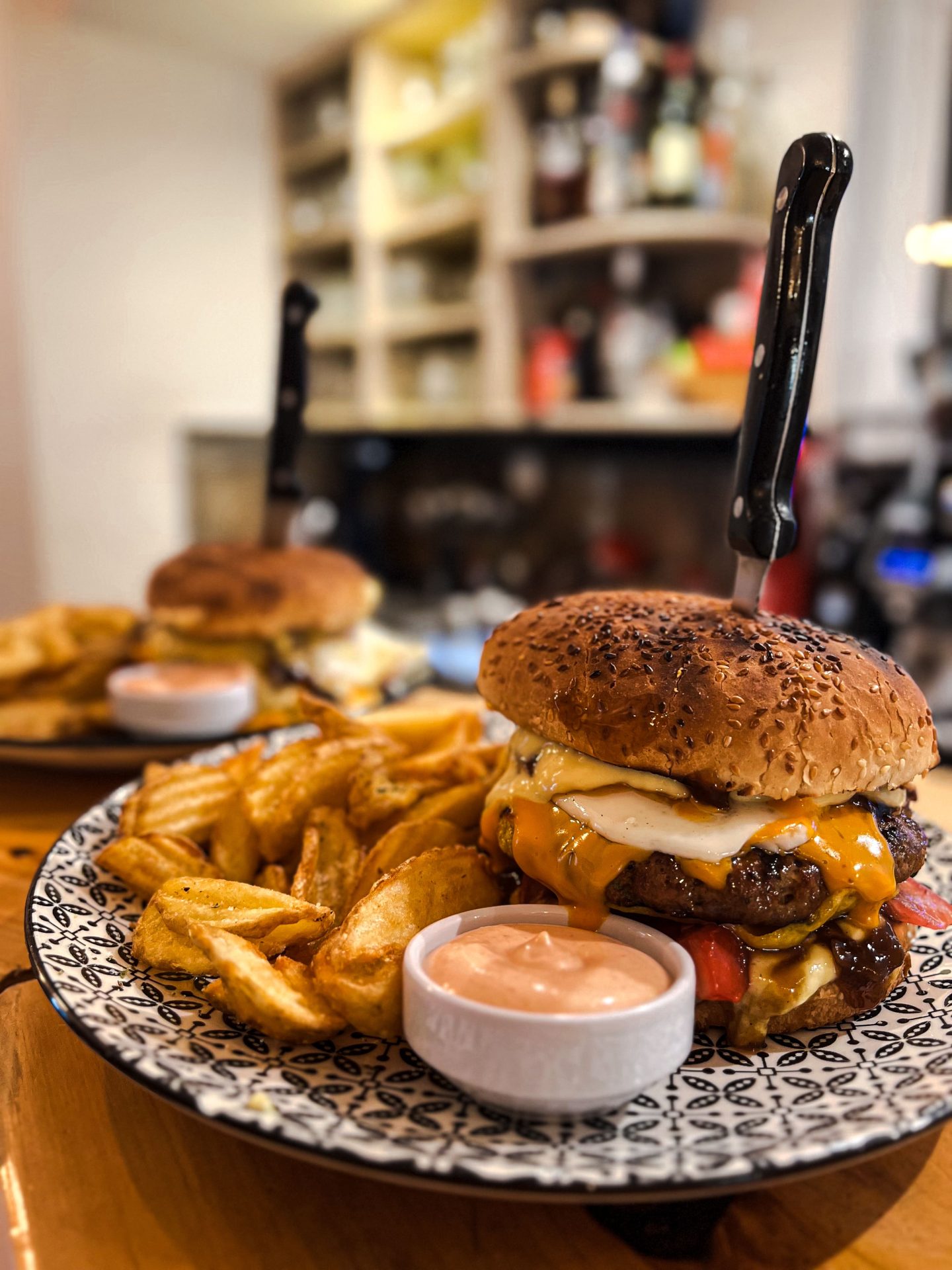 Beef burger with fried egg and caramelized onions at Fabricia Café, Spili